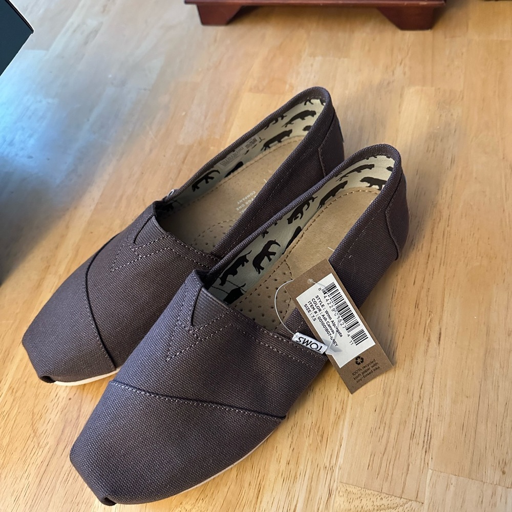 Brand new Toms, still have the tags on.